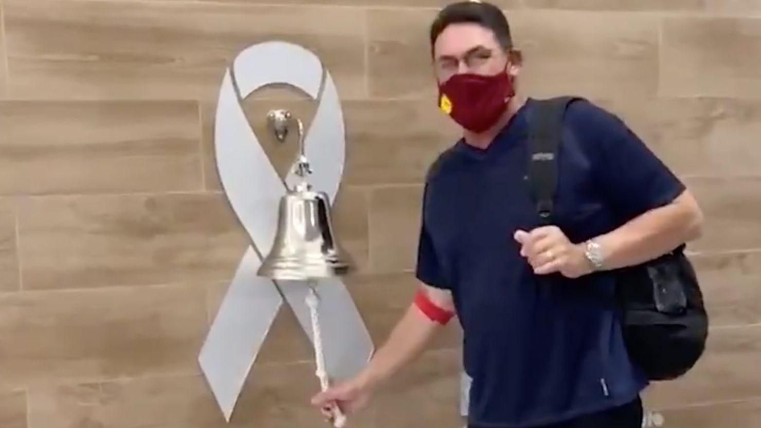 Washington coach Ron Rivera rings a bell after finishing his final round of cancer treatments. 