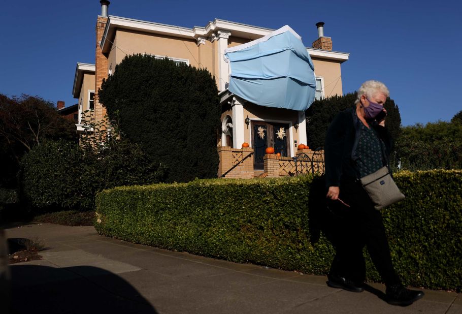 An oversized surgical mask is displayed on the front of a house in San Francisco. The homeowner put it there ahead of Halloween.