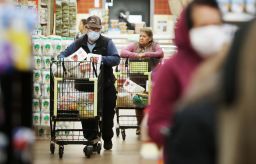Seniors shop at Northgate Gonzalez Market on March 19 in Los Angeles. Storing extra groceries and other items is an important step in slowing the spread of the coronavirus. 