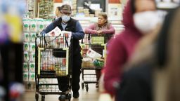 Seniors shop for groceries during special hours open to seniors and the disabled only at Northgate Gonzalez Market, a Hispanic specialty supermarket, on March 19 in Los Angeles.