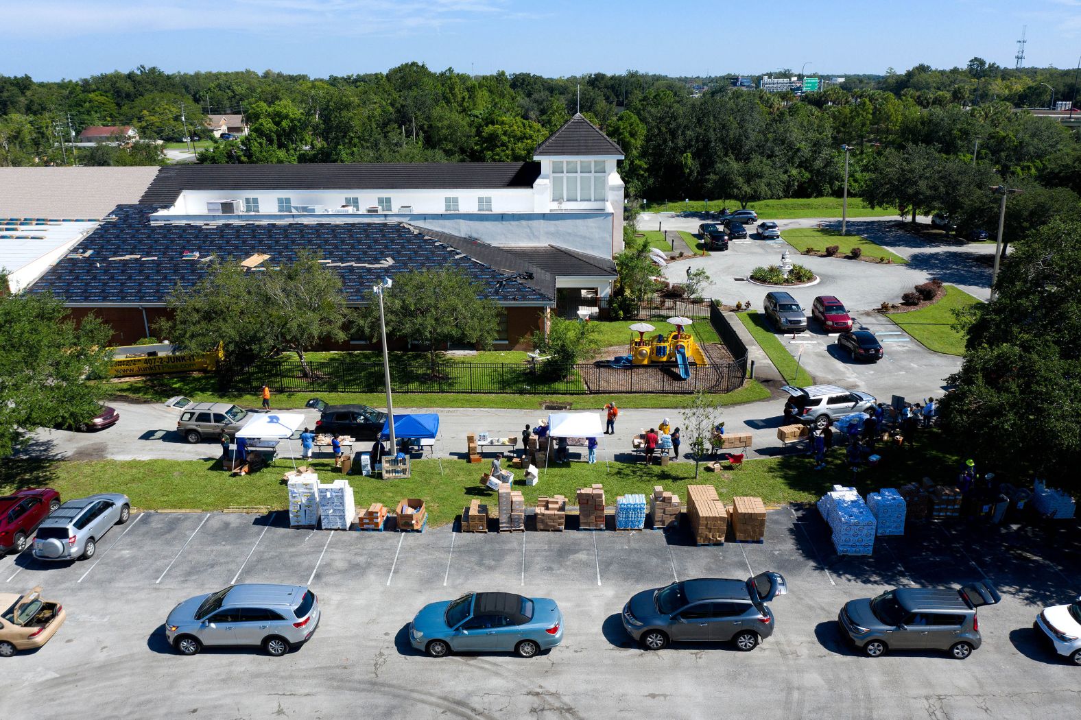Vehicles line up in August as food is distributed by the Second Harvest Food Bank of Central Florida.