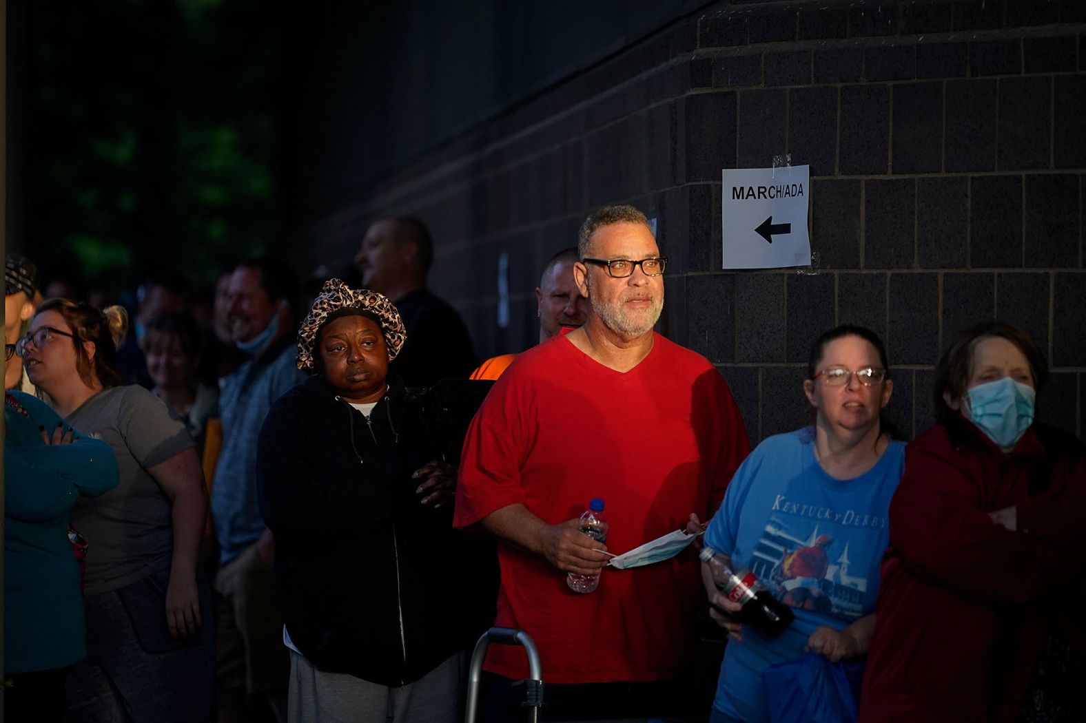 Hundreds of people line up outside the Kentucky Career Center in Frankfort two hours before it opened in June. They were there to find assistance for their unemployment claims.