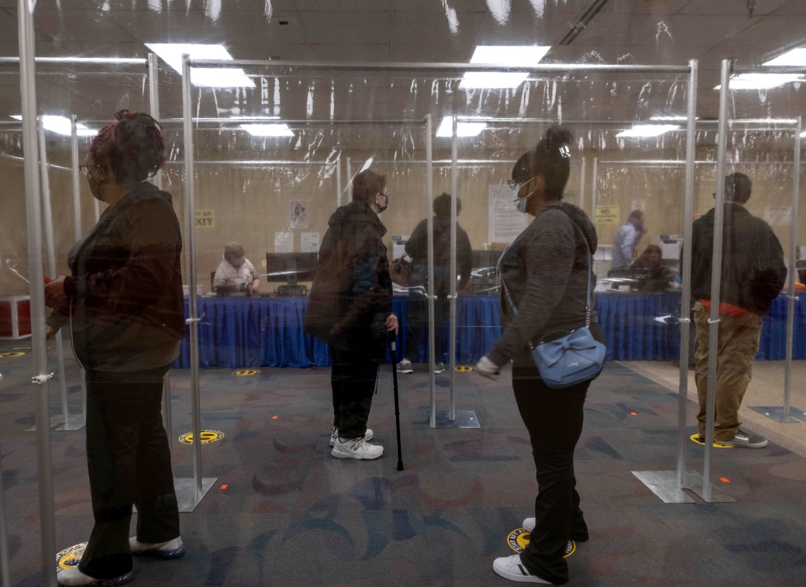 People wait behind plastic barriers to vote in Toledo, Ohio, on October 6.