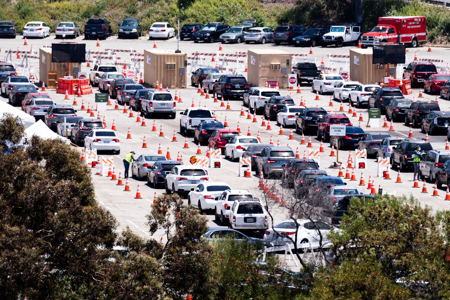 Vehicles line up for Covid-19 testing at Los Angeles' Dodger Stadium in June.