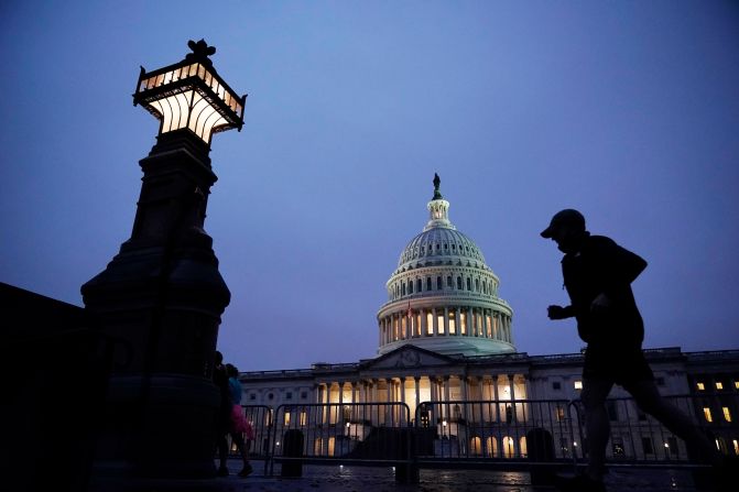 A jogger takes a early morning run at the Capitol on October 26.