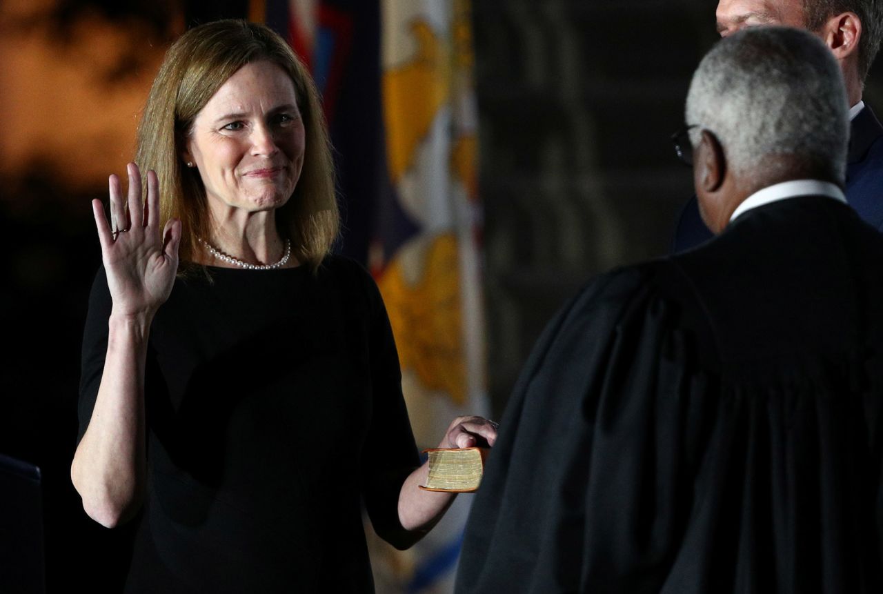 Barrett is sworn in as a Supreme Court justice during a White House ceremony on October 26.