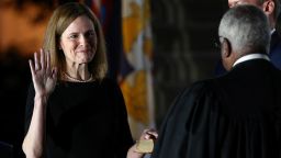 Judge Amy Coney Barrett holds her hand on the Holy Bible as she is sworn in as an associate justice of the U.S. Supreme Court by Supreme Court Justice Clarence Thomas on the South Lawn of the White House in Washington, U.S., October 26, 2020.   REUTERS/Tom Brenner