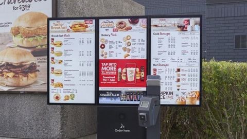 A Tim Hortons digital menu boards with loyalty program integration and  contactless payment. 