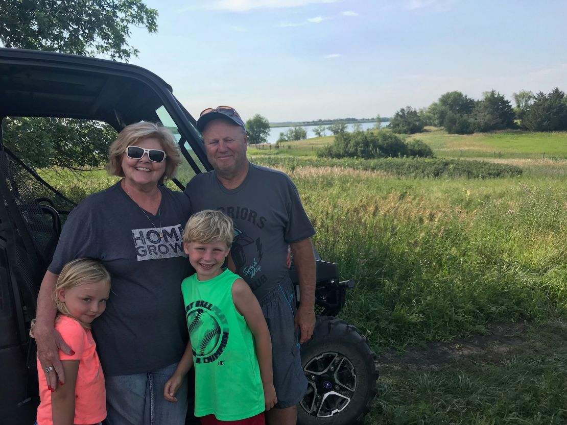 John (right), seen here with his wife Chris and two of his grandchildren, loved to spend time outdoors with his family. 