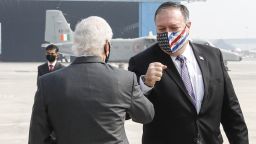 US Secretary of State Mike Pompeo (R) is greeted by US Ambassador to India Kenneth Juster upon his arrival at an airport in New Delhi on October 26, 2020. (Photo by ADNAN ABIDI / POOL / AFP) (Photo by ADNAN ABIDI/POOL/AFP via Getty Images)