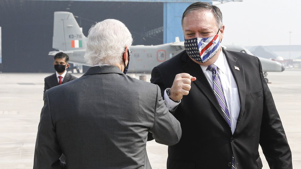 US Secretary of State Mike Pompeo (right) is greeted by US Ambassador to India Kenneth Juster upon his arrival at an airport in New Delhi on October 26, 2020.