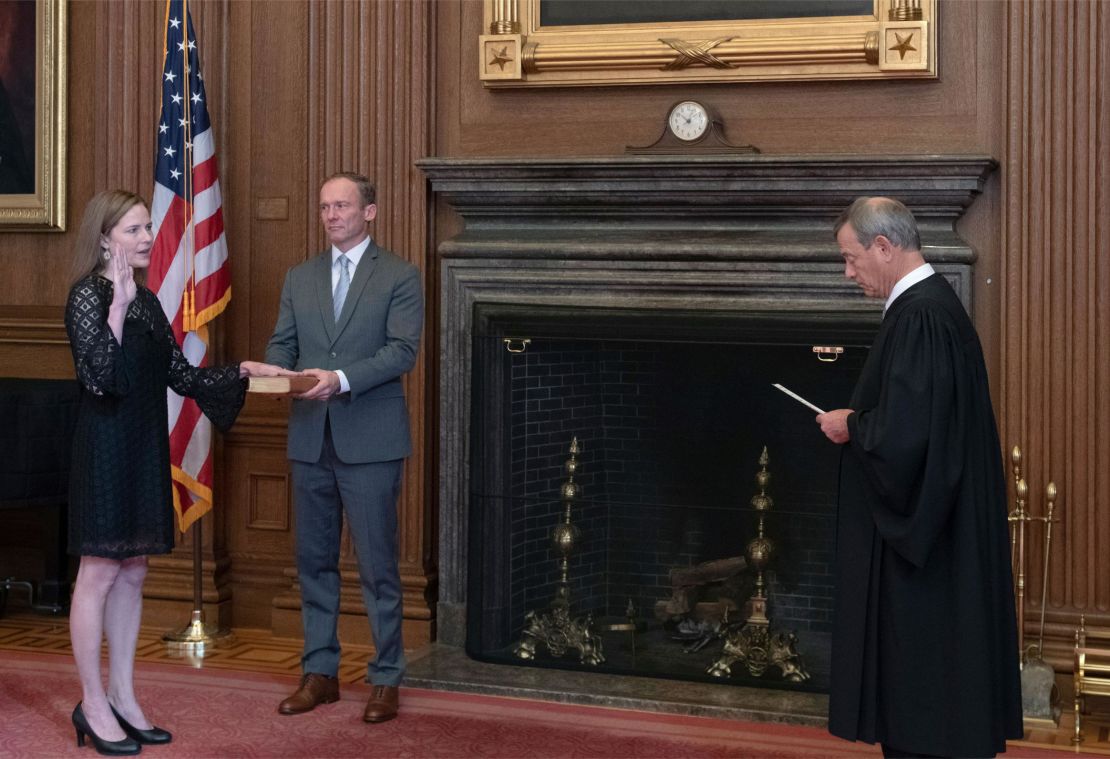 Chief Justice John G. Roberts, Jr., administers the Judicial Oath to Judge Amy Coney Barrett in the East Conference Room, Supreme Court Building. 