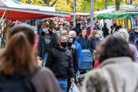 People shop at an outside market in Berlin on October 27.