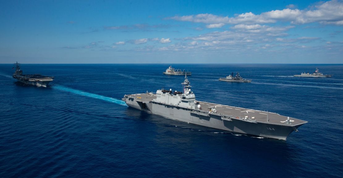 Japan's helicopter destroyer JS Kaga steams with the aircraft carrier USS Ronald Reagan during exercise Keen Sword 21.