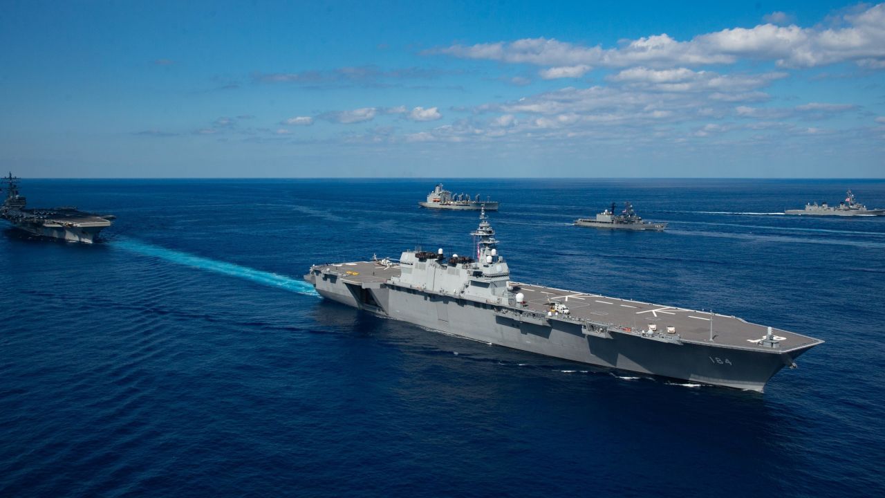 Japan's helicopter destroyer JS Kaga steams with the aircraft carrier USS Ronald Reagan during exercise Keen Sword 21.