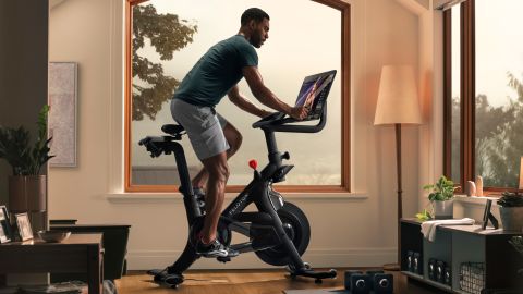 underscored peloton bike plus man riding