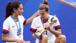 Tobin Heath and Christen Press of the USA celebrate with the FIFA Women's World Cup Trophy (Photo by Alex Grimm/Getty Images)