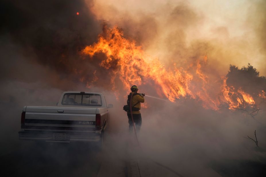 Firefighter Raymond Vasquez battles the Silverado Fire in Irvine on Monday, October 26, 2020.