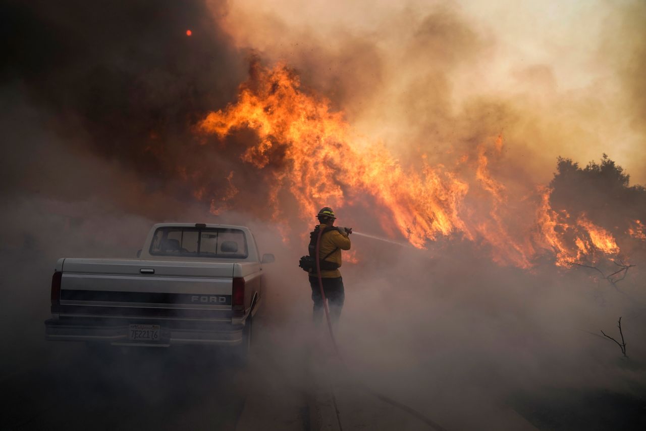 Firefighter Raymond Vasquez battles the Silverado Fire in Irvine on Monday, October 26.