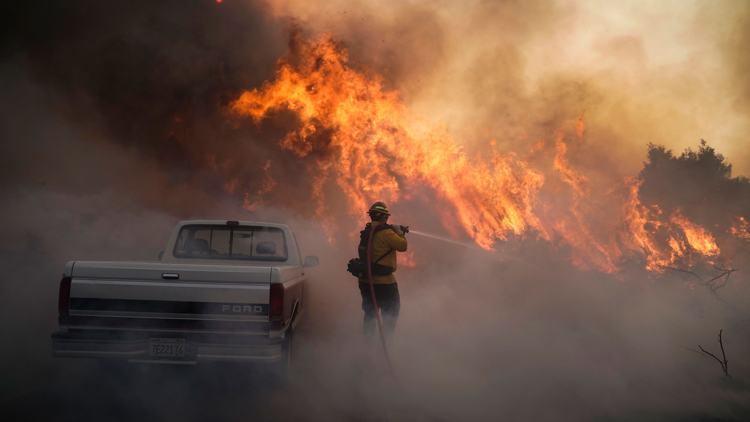 Firefighter Raymond Vasquez battles the Silverado Fire in Irvine on Monday, October 26, 2020.