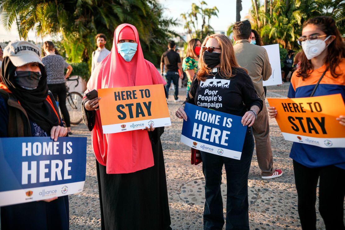 Demontrators hold signs in support of the Supreme Court's ruling in favor of the Deferred Action for Childhood Arrivals program in San Diego, California, on June 18.