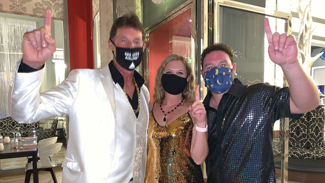 Captain Paul Holmes (far left), Ashleigh Goldberg and her husband, Garrett met up in Playa del Carmen, Mexico on October 9, 2020.