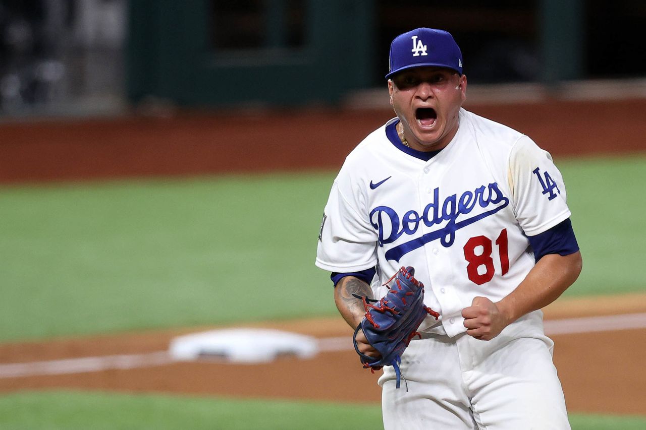 Victor Gonzalez of the Los Angeles Dodgers celebrates after striking out the side against the Tampa Bay Rays during the sixth inning.