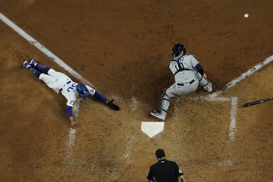 Los Angeles Dodgers' Mookie Betts scores past Tampa Bay Rays catcher Mike Zunino during the sixth inning.