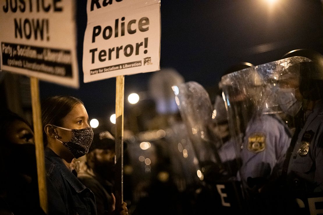 Demonstrators gather Tuesday to protest near where Walter Wallace Jr. was killed in Philadelphia.
