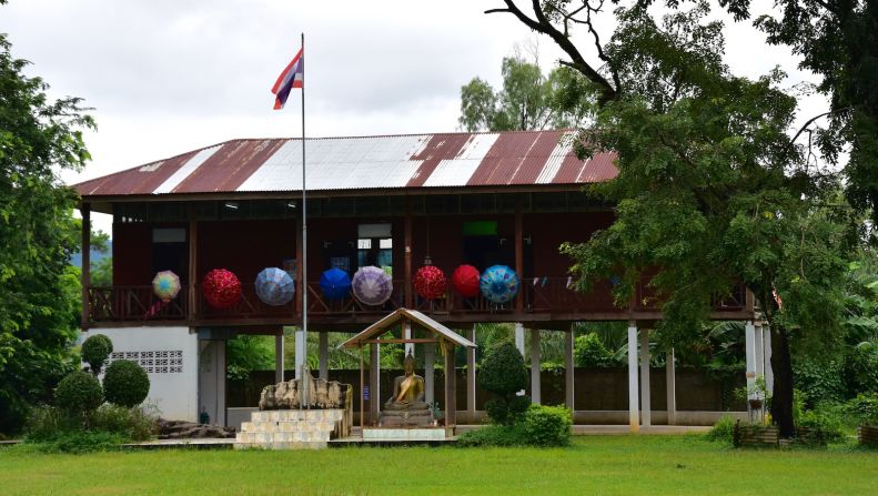 <strong>Ban Nong Doen Tha schoolhouse: </strong>With their umbrellas hung on the balcony, students could be heard shouting out answers in this schoolhouse during a recent visit to the village of Ban Nong Doen Tha.