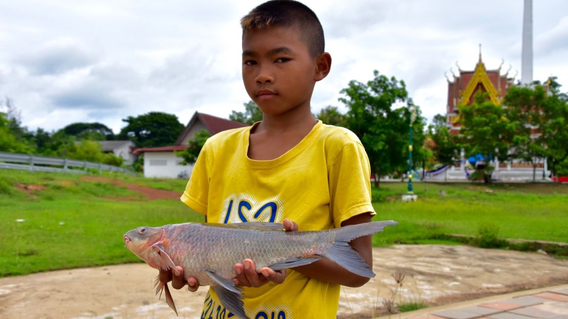 A young boy shows off his catch one morning on the riverfront in Khong Chiam, the easternmost district of Ubon Ratchathani province.