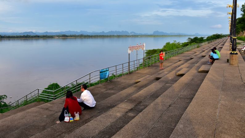 <strong>Riverfront in Tha Uthen:</strong> Late light on the riverfront at Tha Uthen, a town located north of Nakhon Phanom city, capital of the province of the same name. Across the river you can see the limestone massifs of Tha Khaek in Laos, an area that was popular with adventure travelers before the pandemic hit.