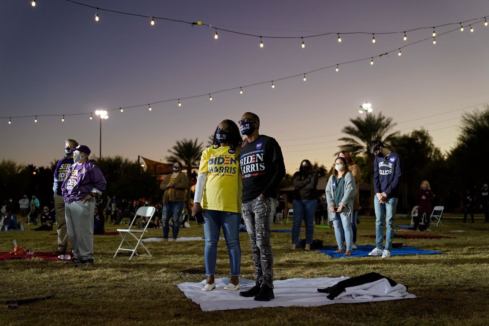 People listen as Kamala Harris speaks at a campaign event in Las Vegas on October 27.