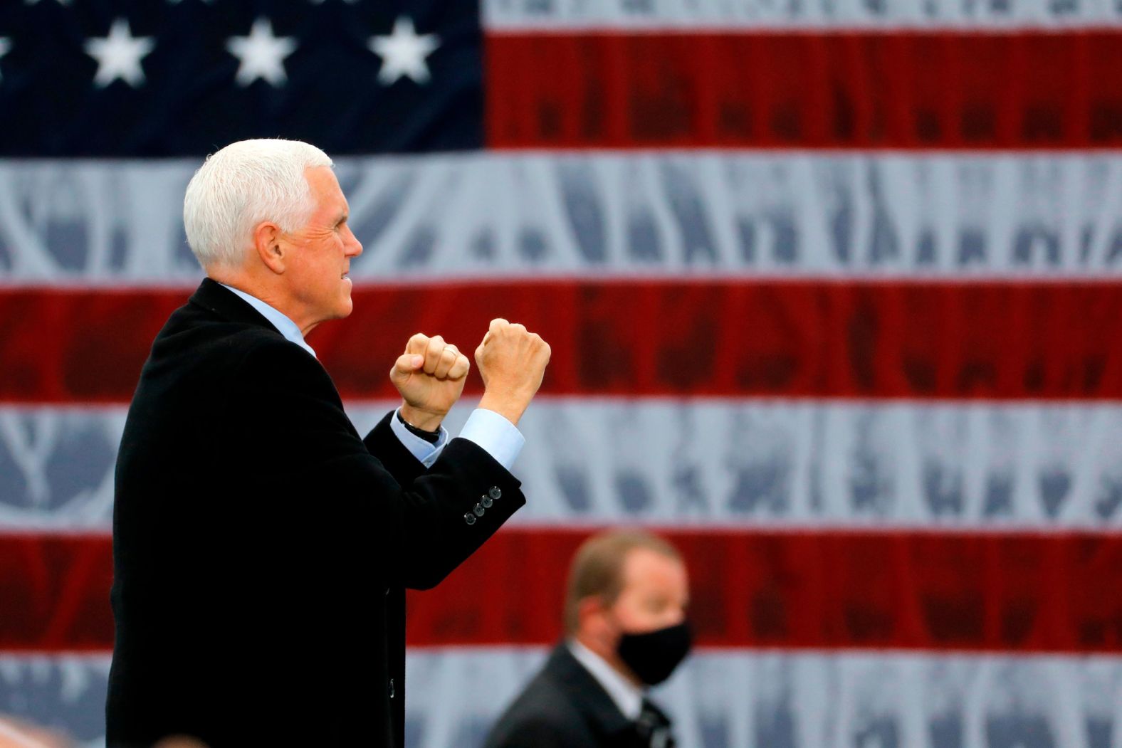 Vice President Mike Pence walks on stage for a campaign rally in Waterford, Michigan, on October 22.