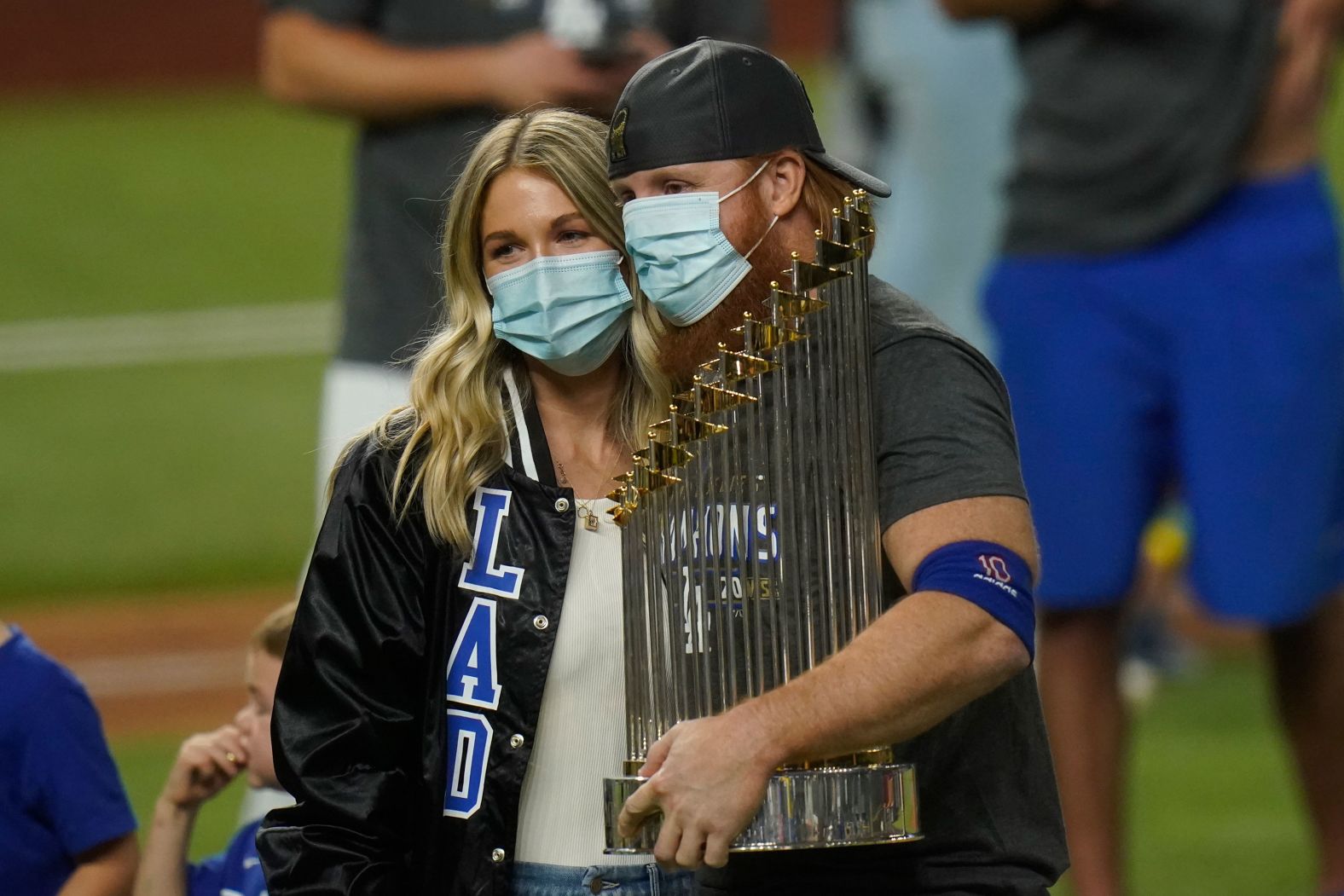 Dodgers third baseman Justin Turner celebrates with the trophy. He had to be pulled in the middle of Game 6 <a href="index.php?page=&url=https%3A%2F%2Fwww.cnn.com%2F2020%2F10%2F28%2Fsport%2Fjustin-turner-coronavirus-los-angeles-dodgers-world-series-spt-intl%2Findex.html" target="_blank">after testing positive for Covid-19.</a> He returned to the field for the postgame celebrations.