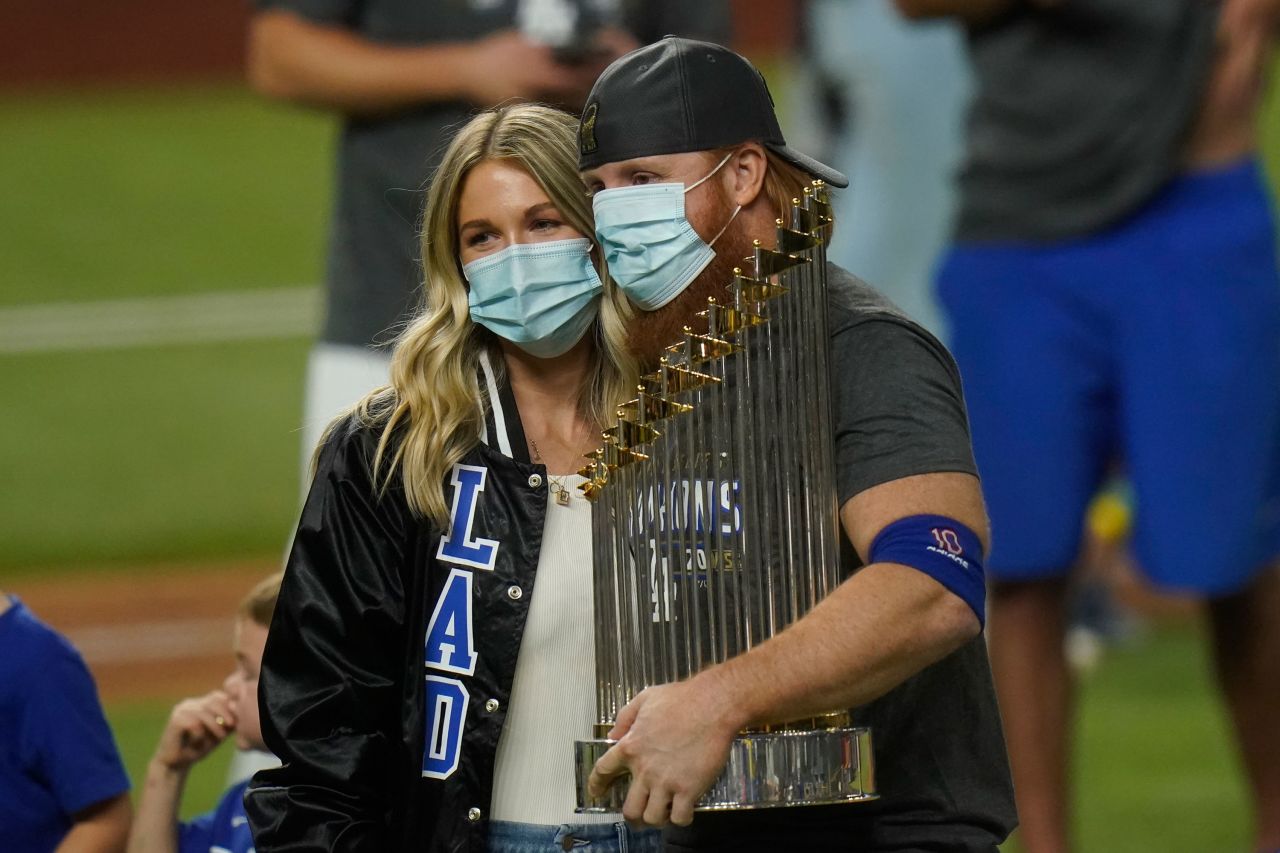 Dodgers third baseman Justin Turner celebrates with the trophy. He had to be pulled in the middle of Game 6 <a href="index.php?page=&url=https%3A%2F%2Fwww.cnn.com%2F2020%2F10%2F28%2Fsport%2Fjustin-turner-coronavirus-los-angeles-dodgers-world-series-spt-intl%2Findex.html" target="_blank">after testing positive for Covid-19.</a> He returned to the field for the postgame celebrations.