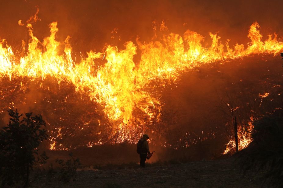 Firefighters conduct a backfire operation in Chino Hills on October 27, 2020.