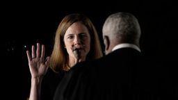 Clarence Thomas, associate justice of the U.S. Supreme Court, right, administers the judicial oath to Amy Coney Barrett, associate justice of the U.S. Supreme Court, during a ceremony on the South Lawn of the White House in Washington, D.C., U.S., on Monday, Oct. 26, 2020. The Senate voted 52-48 Monday to confirm Barrett to the Supreme Court, giving the court a 6-3 conservative majority that could determine the future of the Affordable Care Act and abortion rights. Photographer: Ken Cedeno/CNP/Bloomberg via Getty Images