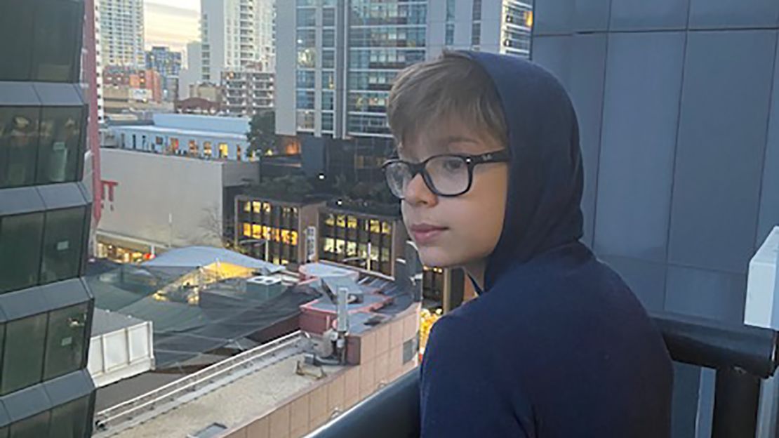 Jack Levine peers out the window of the Meriton Suites Hotel in Sydney.