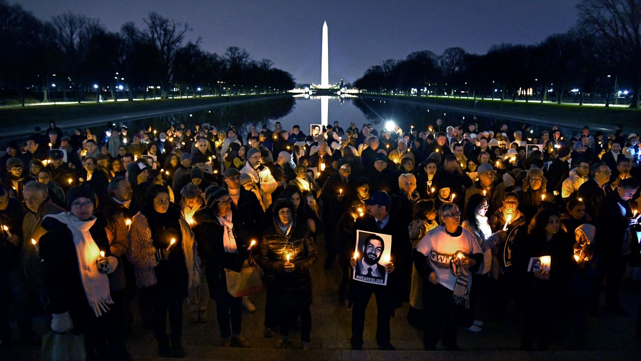 Holding candles and photos, friends and family gathered at the Lincoln Memorial to remember Bijan Ghaisar.