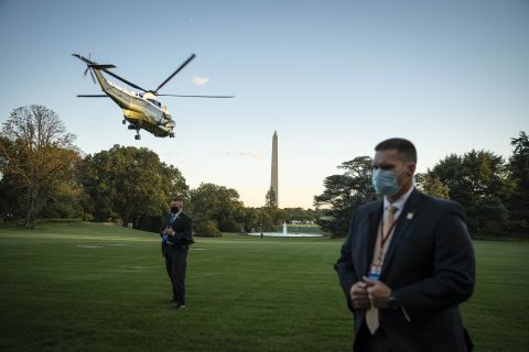 Secret Service agents stand on the South Lawn of the White House as the President is flown to Walter Reed Medical Center on October 2, 2020. He stayed at the hospital for three nights, receiving medical treatment after <a href="https://www.cnn.com/interactive/2020/10/politics/trump-covid-battle/" target="_blank">his Covid-19 diagnosis.</a>
