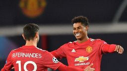 Manchester United's English striker Marcus Rashford (R) celebrates scoring his team's third goal, his second, with Manchester United's Portuguese midfielder Bruno Fernandes, during the UEFA Champions league group H football match between Manchester United and RB Leipzig at Old Trafford stadium in Manchester, north west England, on October 28, 2020. (Photo by Anthony Devlin / AFP) (Photo by ANTHONY DEVLIN/AFP via Getty Images)