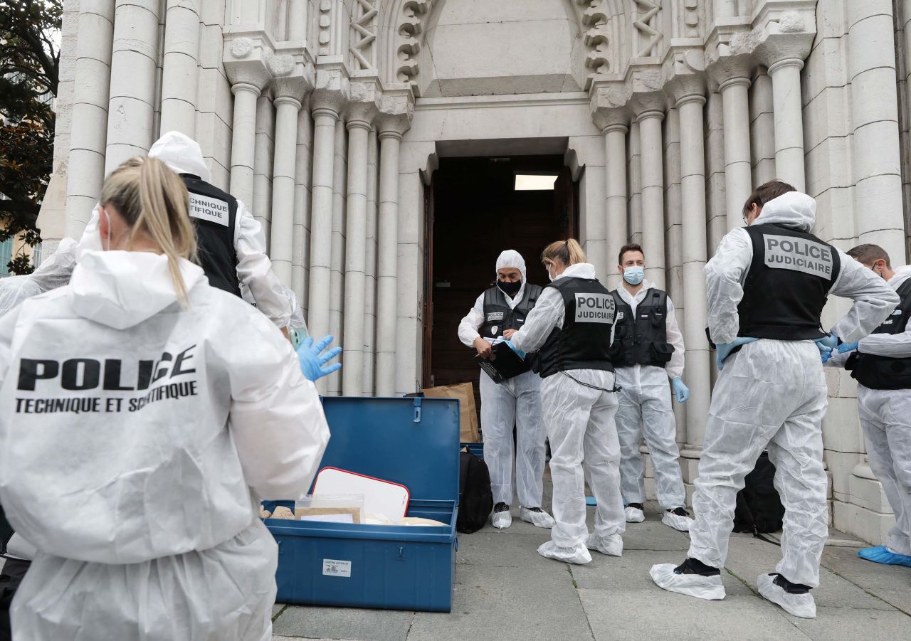 Forensics officers work at the Basilica.