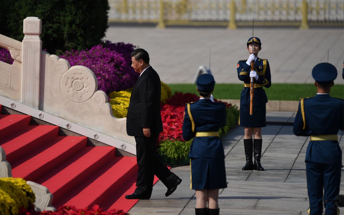 Chinese President Xi Jinping walks to the Monument to the Peoples Heroes during a wreath laying ceremony to honour deceased national heroes on Martyrs Day in Beijings Tiananmen Square on September 30.