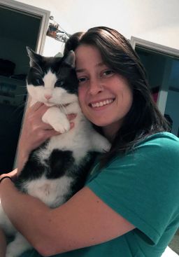 Kaitlyn Romoser and her 7-year-old cat, Phoenix, both tested positive for the coronavirus. Romoser tested positive in March and again in September.