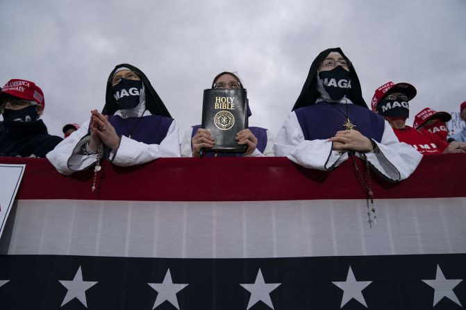 Supporters of US President Donald Trump listen to him speak during a campaign rally in Circleville, Ohio, on October 24.