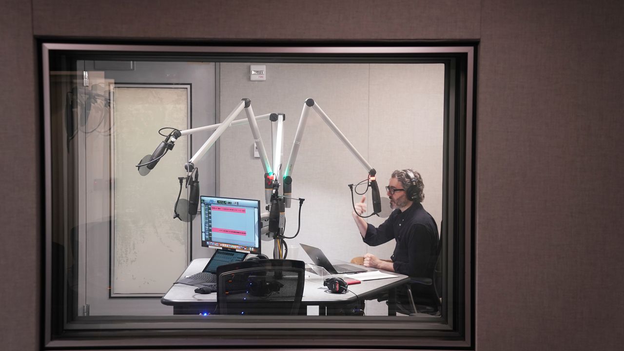 "The Daily" host Michael Barbaro in the studio (Photo by Damon Winter/The New York Times)