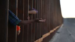 SUNLAND PARK, NEW MEXICO - JUNE 24: A child reaches through from the Mexican side of the U.S./Mexico border fence on June 24, 2018 in Sunland Park, New Mexico. The Trump administration's 'zero tolerance' policy on immigration has created confusion for those seeking to immigrate to the United States.  (Photo by Joe Raedle/Getty Images)