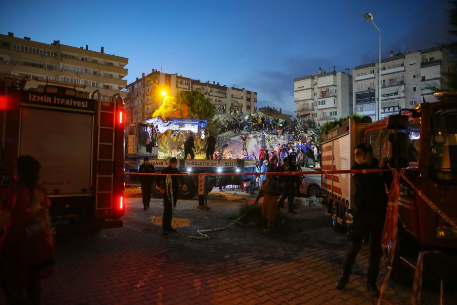 Search-and-rescue work is conducted at a collapsed building in Izmir.