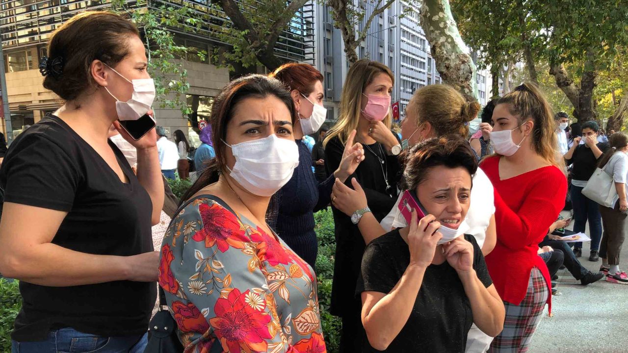 People standing outside their homes in Izmir, Turkey, on Friday.